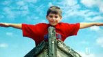 The boy in the bright red shirt