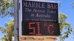 Roads melt as temps soar but locals keep their cool
