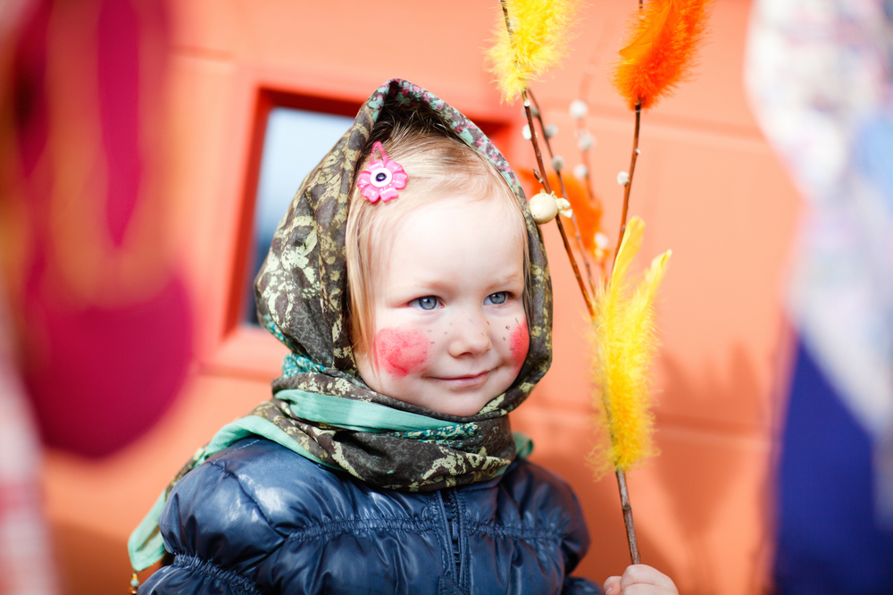 A Finnish girl with her decorated willow branch