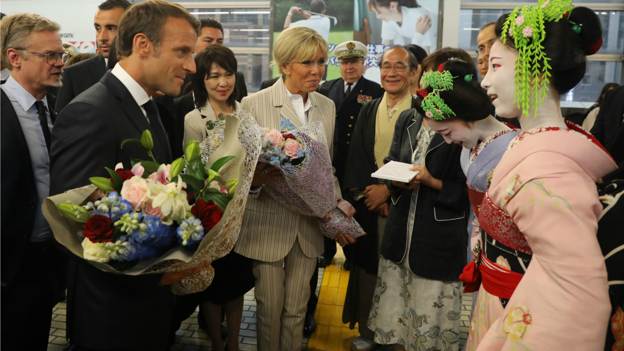 French First Lady Brigitte Macron Elevates Classic Navy Suiting