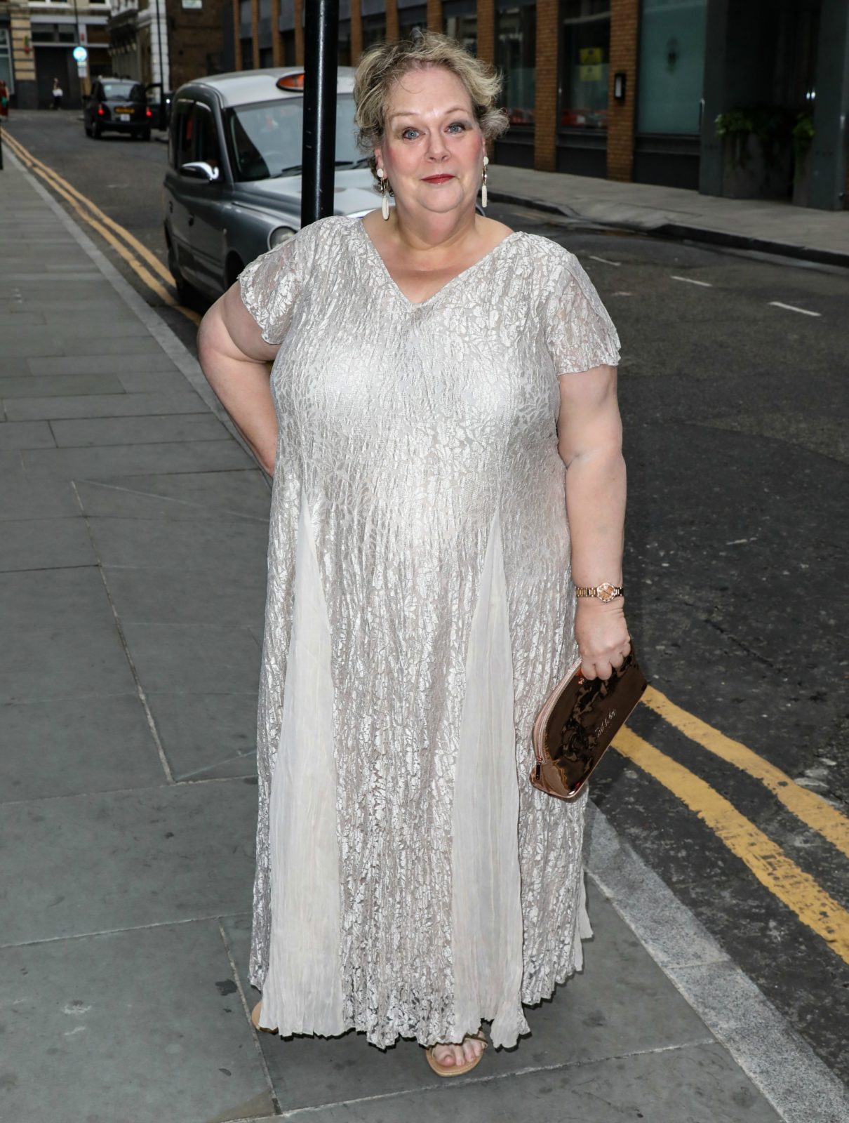 The Chase’s Anne Hegerty ramps up the glamour in dazzling silver dress 