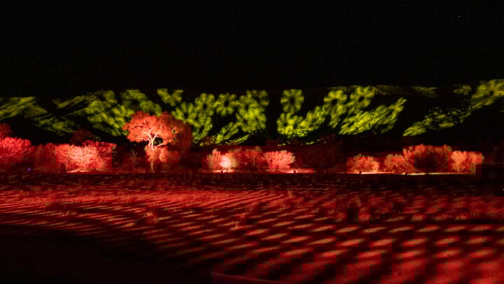 Parrtjima takes over Alice Springs with ten nights of light installations from a number of Indigenous artists set against the majestic MacDonnell Ranges.  Credit: Tourism NT/The Ebb & Flow of Sky & Country