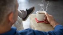 He turned to a table where another man was sitting alone, drinking his coffee. Source: Getty Images