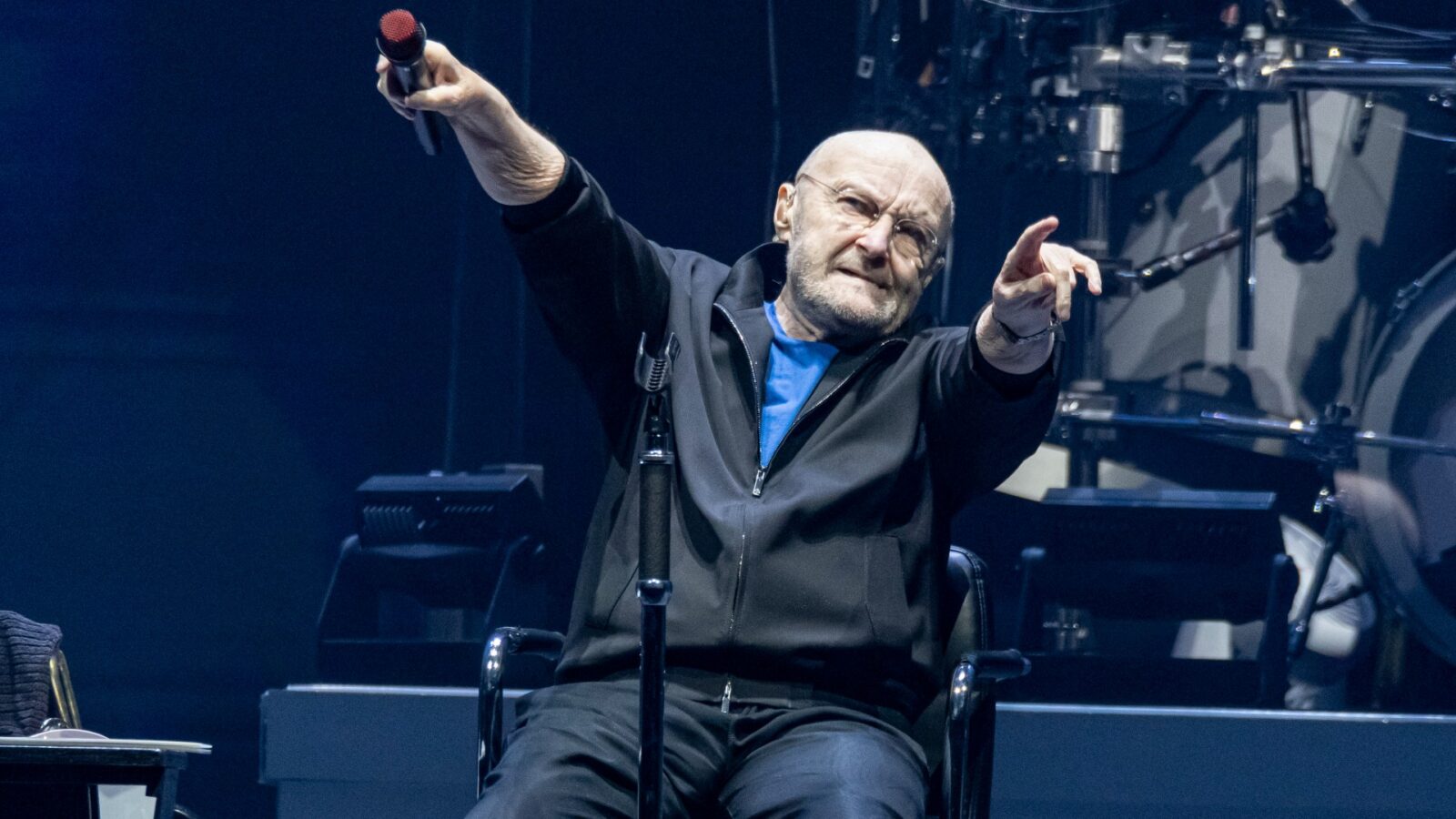 Why is Phil Collins Performing from a Chair - Know How Community