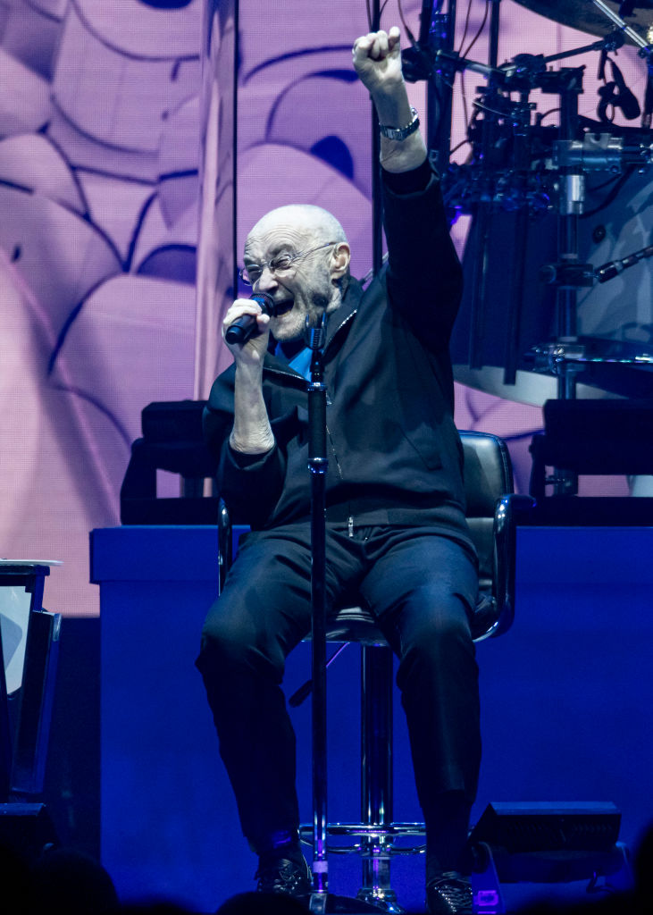 Ailing Phil Collins, 70, performs seated in a chair as singer battles ...