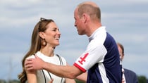 The two were dressed impeccably, Kate donning a stunning tailored black and white dress paired with heeled flats and William dressed in full polo attire Source: Getty